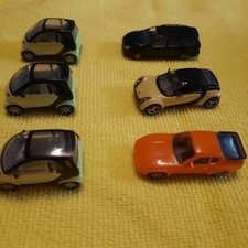 Konvolut von 6 Miniaturautos 1/87 4x Smart 1x Ford  Kombi und 1 Porsche 944