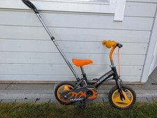 Mini-Kinderfahrrad mit Lenkstange schwarz/orange gebraucht