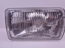 VW Passat Typ 32  H4-Hauptscheinwerfer Hella 9DF120479-001 links front Headlight