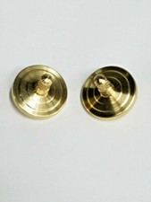 TWO METAL SPINNING TOPS *