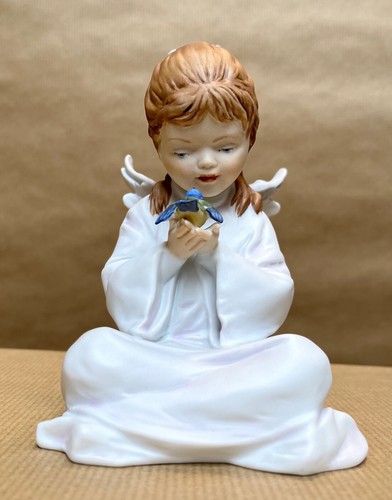 Porzellanfigur engel mit vogel - mit,