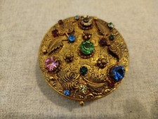 Goldene Schatulle Dose mit bunten Steinen