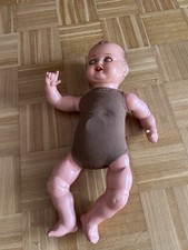 Alte Babypuppe mit Glasaugen