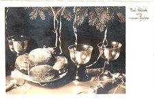 AK  -1934-  Neujahr - Porzellan-Teller m. Krapfen und Gläser