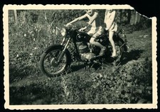 Children sitting on motorcycle