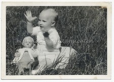Little Boy with Doll in Garden