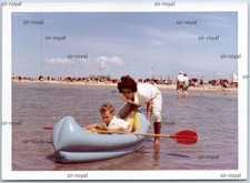 Boy in Blue Rubber Boat Canoe
