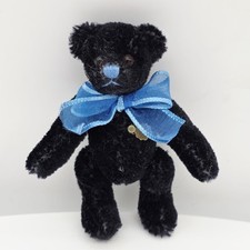 Hermann Teddy Miniatur 10 cm schwarz mit blauer Schleife