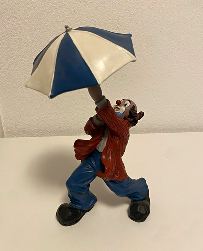 Gilde clown mit schirm hält - gilde,