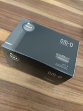 OM System. Olympus HLD-9