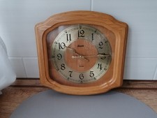 Skania Wanduhr Holzgehäuse/Metallziffernblatt L:28,5cm H:26,5cm  B:2,5/5cm