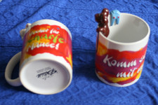 2 Kaffeebecher von der lustigen Diddlmaus mit Figur am Tassenrand_Depesche_Tiere