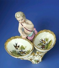 A1484 Figürliche Saliere mit Putto, Vogel Dekor, Paris um 1900, Plus Zugabe