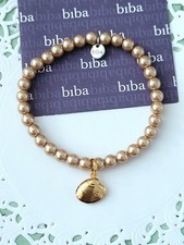 Biba Armband gold, dehnbar, 18 cm mit Muschel Anhänger, Neu/H313
