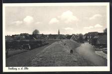 Ansichtskarte Freiburg a. d. Elbe, Ortsansicht mit Kirche und Deich 