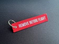 Remove before flight Schlüsselanhänger Flugzeug Rot 1 Stück 
