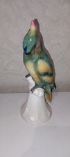 sitzender Papagei Figur 