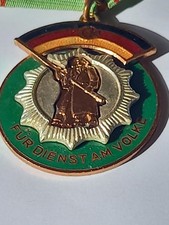DDR Orden  für Dienst am Volke mit Feldspange, plastisch hervorgehoben