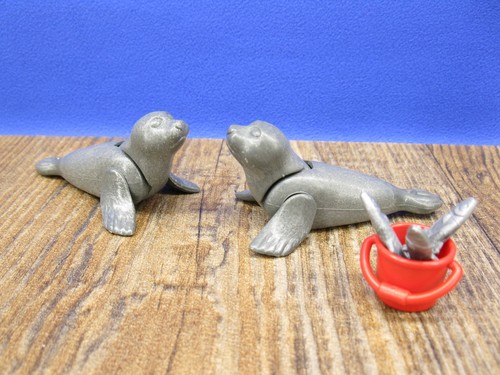 Seehunde mit eimer fische - ,