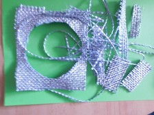 Christo - Wrapped Reichstag - Gewebefäden, Stoffstückchen, Reststücke