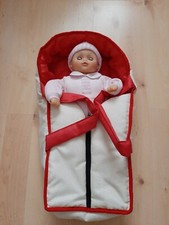 Babypuppe mit Tragetasche