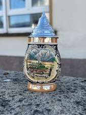 Bierkrug mit Zinndeckel aus