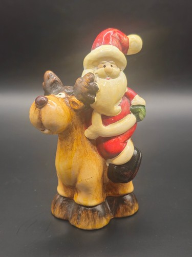 Weihnachtsmann auf rentier - auf,