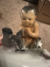 Porzellanfigur Faun mit Rabe