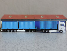 Herpa 1:87 - MAN TGX GX 8-achs Abroll-/Flachbetthängergliederzug - "weiß-blau"