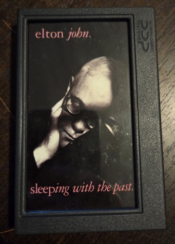 Elton john sleeping with the - elton,