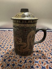 Yixing clay mug with tea - clay,