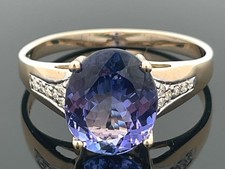 RING GR. 21(CA. 65) AUS 585/GELBGOLD MIT TANSANIT AAAAA & BRILLANTEN SCHMUCKJAGD