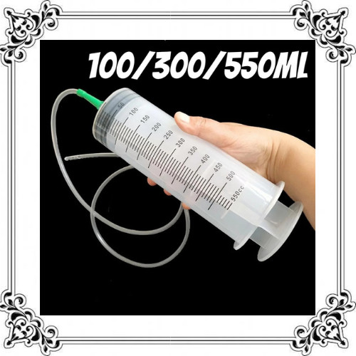 Large syringe with hose