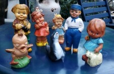 7 alte Quietschfiguren