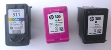Drei leere Druckerpatronen HP 305 und Canon 511