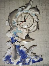 Standuhr mit Delphin Pendel