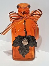 Vase orange mit Blatt Herbst