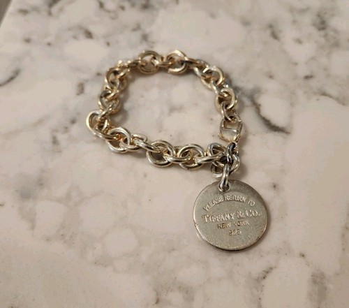 Please return tiffany co - tiffany, &