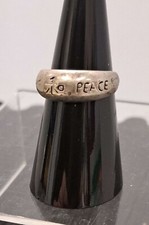 Silver tone ring engraved