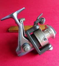 EINE GUTE GEBRAUCHTE SHIMANO SYNCOPATE CROSSFIRE 11 2000FA SPINNROLLE