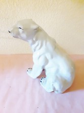 Porzellanfigur sitzender