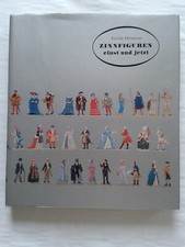 Tin figures then and now