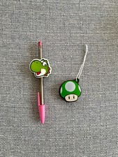 Kinder Joy Super Mario 2025 2er Set: Yoshi Stiftehalter + grüner Pilz Pop It