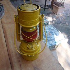 Petroleumlampe Feuerhand 276 Baby Spezial Sturmkappe gelb Glas rot