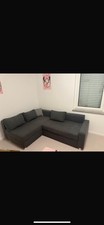 Graues Sofa mit Schlaffunktion