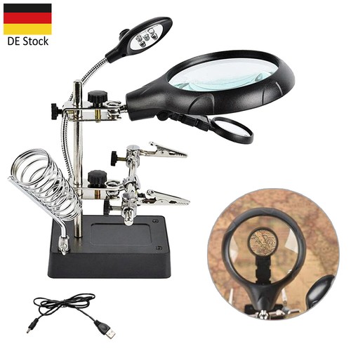 Dritte hand mit lupe löt - hand, löt-und