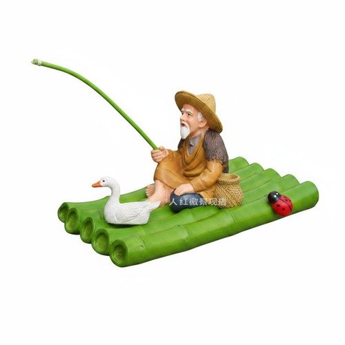 Fischerfigur auf bambusfloß - auf,