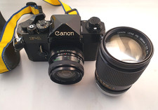 Canon F-1 35mm Fotokamera mit Vivitar 2,8/24mm; 2,5/135mm Chromring und Tasche