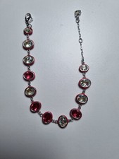 Armband  170  bis 210 mm rote Schalen diejeweils einen Stein enthalten Swarovski