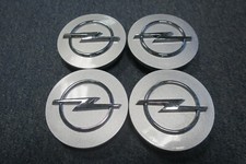 4 Nabenabdeckungen/Radkappen für Alufelgen von Opel in silber 65mm